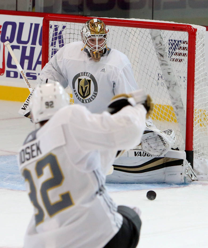 Vegas Golden Knights goalie Calvin Pickard blocks Tomas Nosek's (92) shot during team's practice at City National Arena on Monday, Sept. 18, 2017, in Las Vegas. Bizuayehu Tesfaye Las Vegas Review- ...