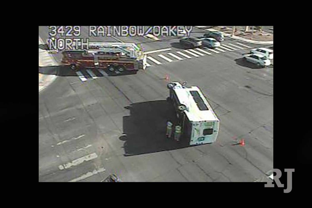 A paratransit bus collided with a dump truck and landed on its side in the Rainbow and Oakey boulevards, Monday, Sept. 18, 2017. (RTC FAST Cameras)