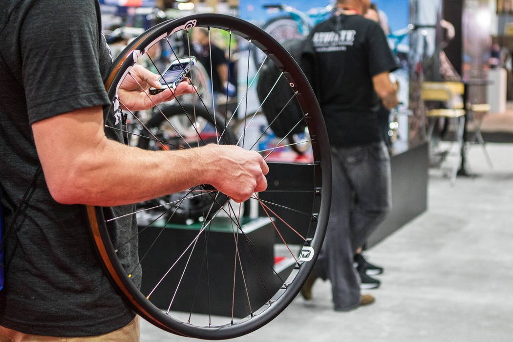 An attendee holds a bike whee at Interbike International Expo at Mandalay Bay Convention Center on Wednesday, Sep. 20, 2017, in Las Vegas. Morgan Lieberman Las Vegas Review-Journal