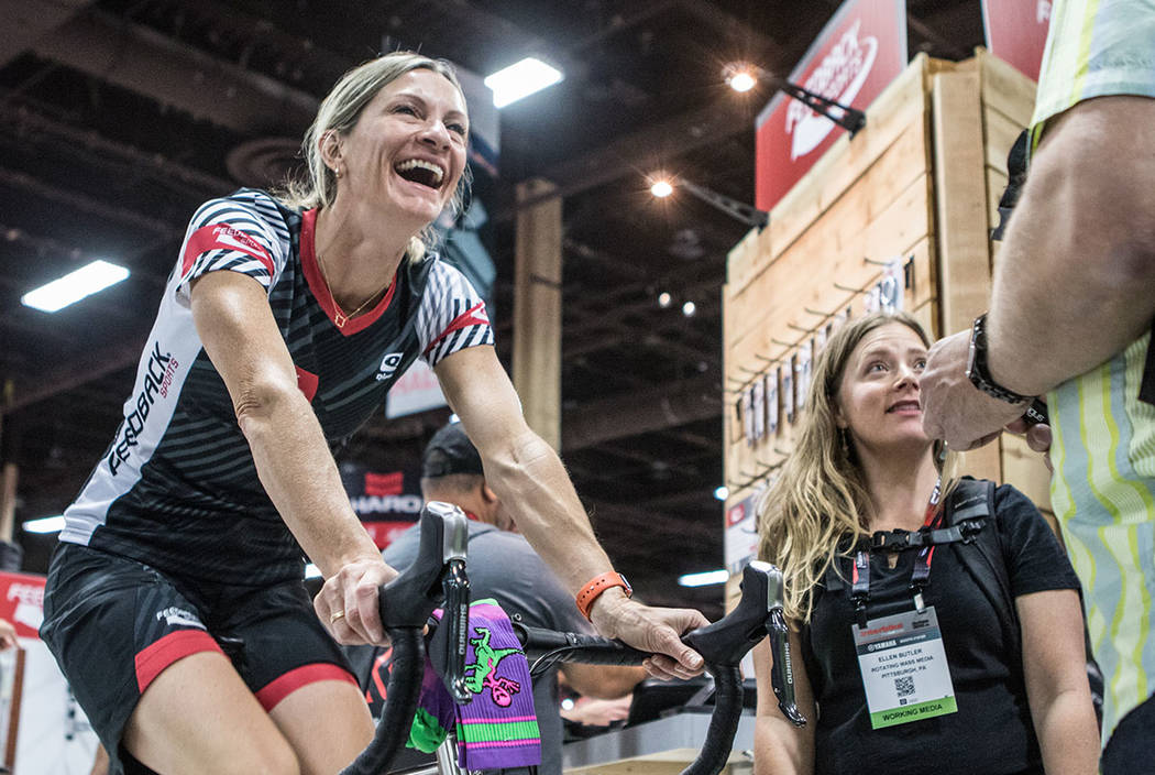 Colorado resident Lisa Hudson, left, cycles while talking to Pennsylvania resident Ellen Butler, right, at Interbike International Expo at Mandalay Bay Convention Center on Wednesday, Sep. 20, 201 ...