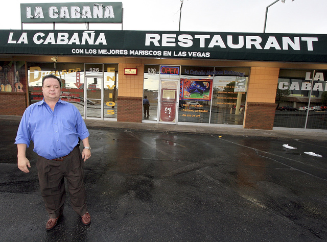 William Jacobs, Sr., owner of La Cabana, pictured in 2009 in front of La Cabaña's original location on Martin Luther King, Jr.  La Cabaña had been in the same location for 25 years until it clos ...