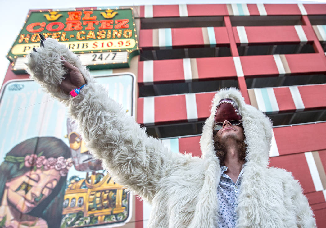 Joseph Valdes gestures at the crowd while wearing his favorite bear coat on 7th Street during the final day of the Life is Beautiful music and arts festival on Sunday, September 24, 2017, in Las V ...