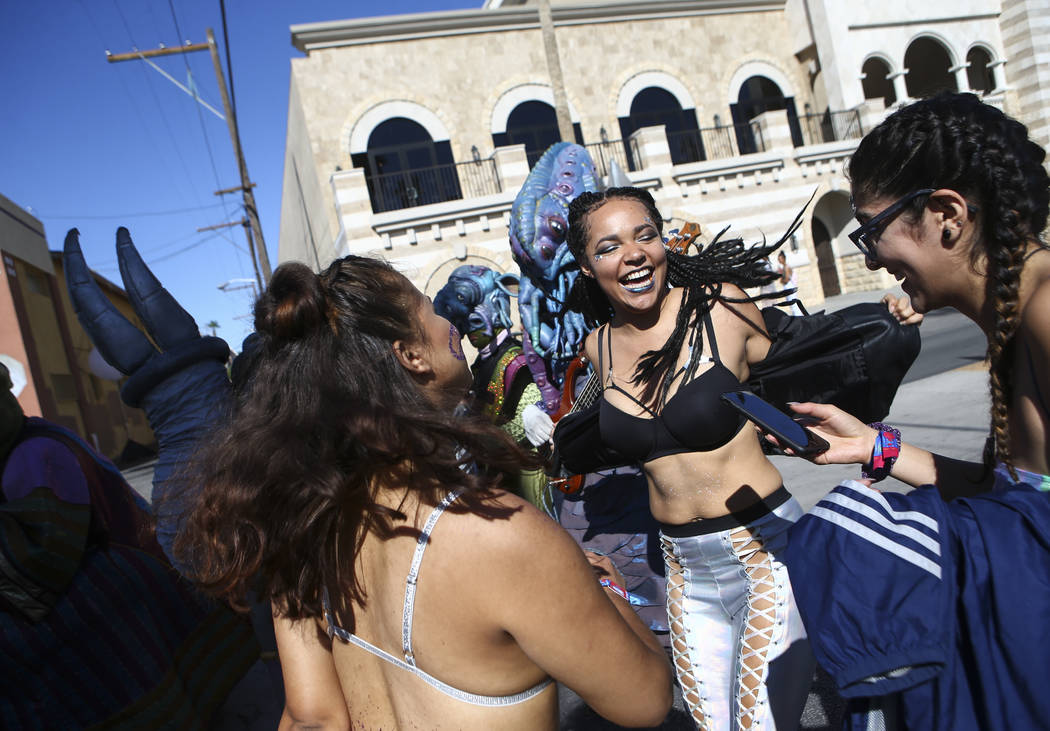 Attendees dance during a performance by art group Big Nazo during the final day of the Life is Beautiful festival in downtown Las Vegas on Sunday, Sept. 24, 2017. Chase Stevens Las Vegas Review-Jo ...