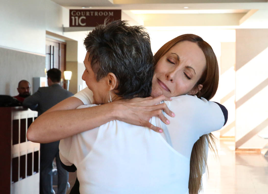 Alexis Plunkett, left, hugs her mother, who declined to give her name, after a district judge dismissed the indictment against Plunkett at the Regional Justice Center on Thursday, Sept. 21, 2017,  ...