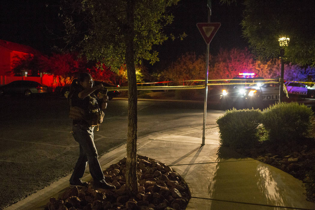 Officers are present in a northwest gated neighborhood near the intersection of North Fort Apache Road and West Grand Teton Drive on Thursday, Sept. 21, 2017, in Las Vegas.  Bridget Bennett Las Ve ...