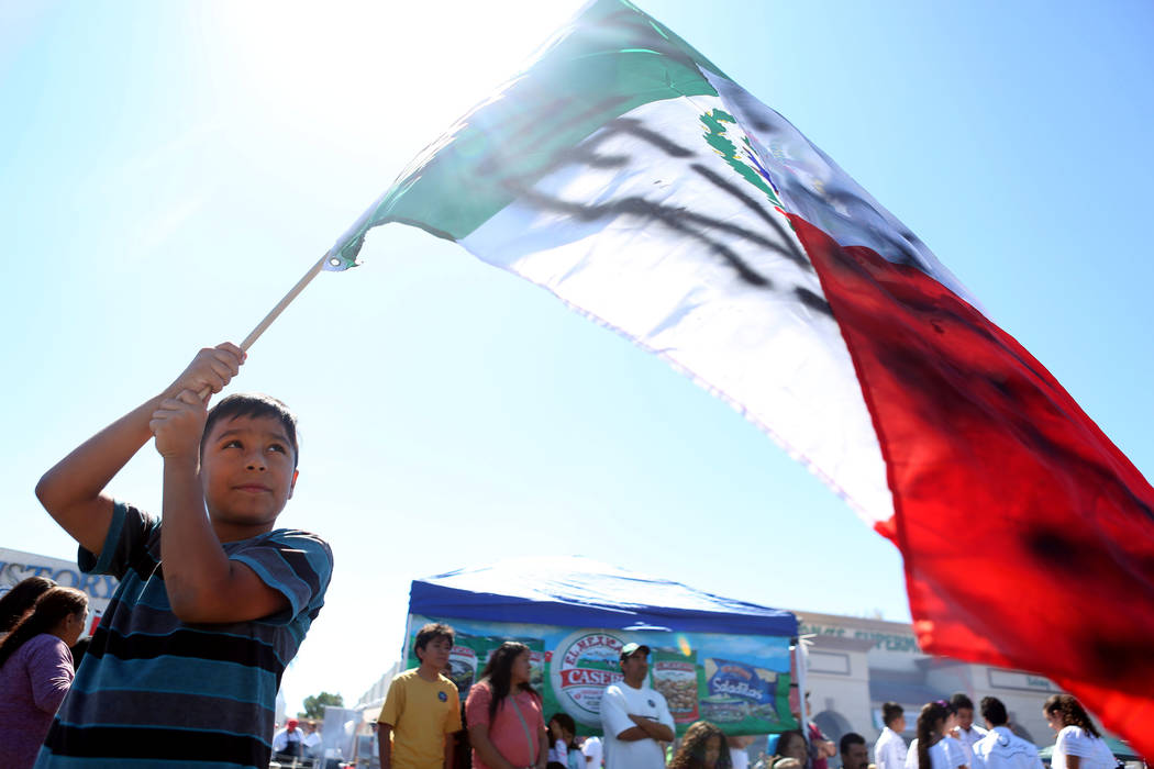Yerick Aleman, 9,  holds a Mexican flag during a Marianaճ Charity Foundation benefit for earthquake victims in Mexico supported by the Latin Chamber of Commerce at Mariana's Supermarket on W ...
