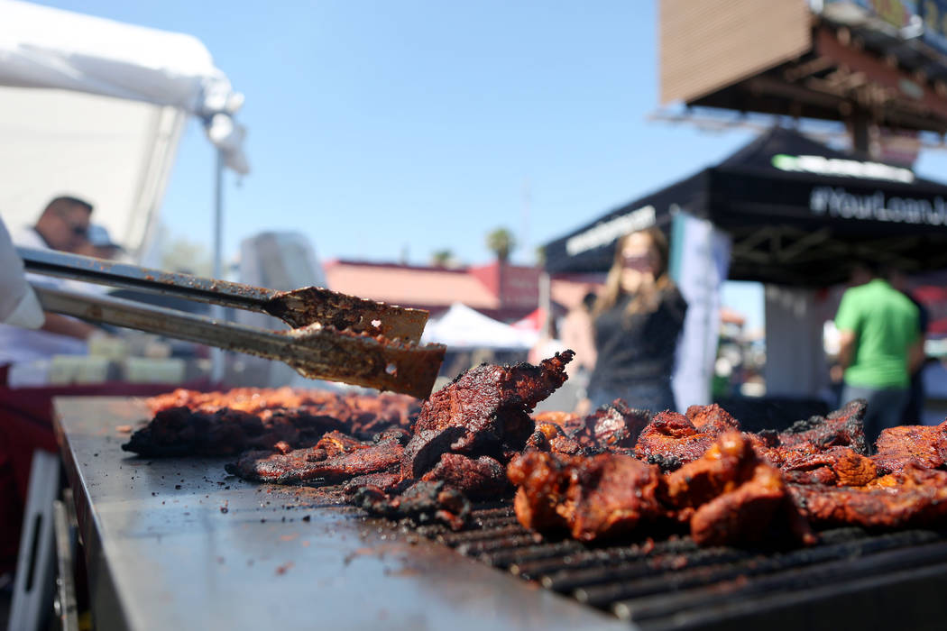 Fresh meat is cooked during a Marianaճ Charity Foundation benefit for earthquake victims in Mexico supported by the Latin Chamber of Commerce at Mariana's Supermarket on West Sahara Avenue a ...