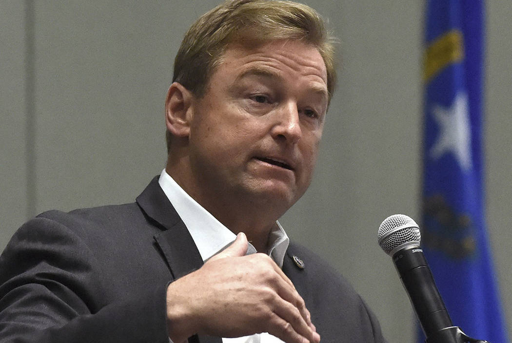 FILE - In this April 17, 2017, file photo, Sen. Dean Heller, R-Nev., answers a question during a town hall at the Reno Sparks Convention Center in Reno, Nev.  (Andy Barron /The Reno Gazette-Journa ...