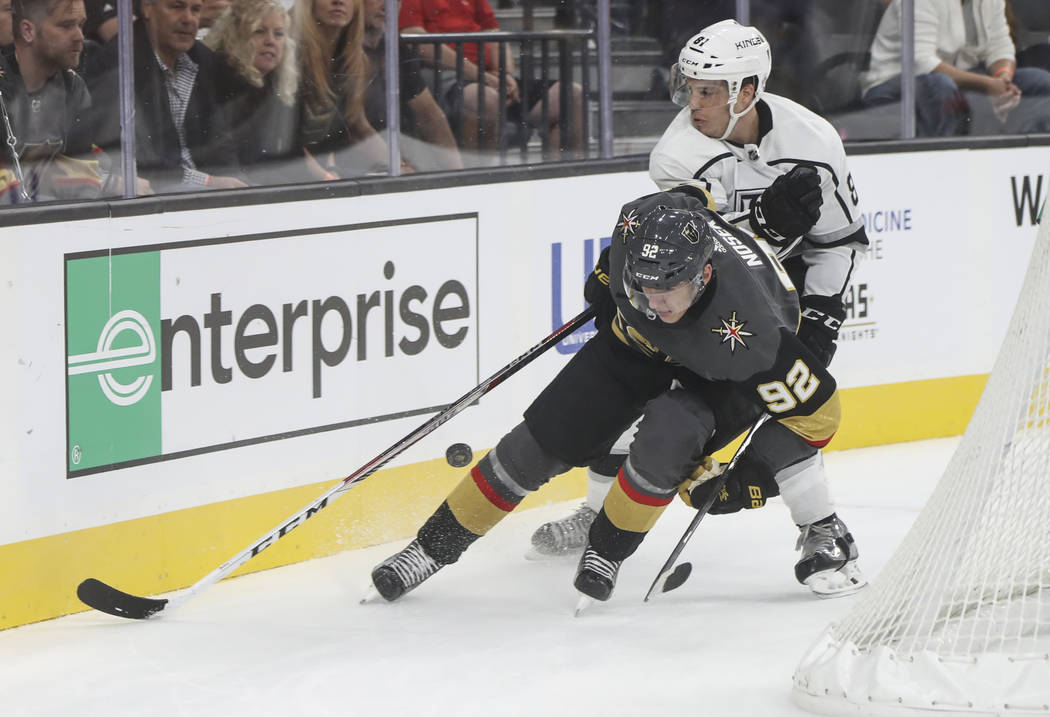 Golden Knights' Tomas Nosek (92) and Los Angeles Kings' Matt Roy (81) go after the puck during an NHL preseason hockey game at T-Mobile Arena in Las Vegas on Tuesday, Sept. 26, 2017. The Kings won ...