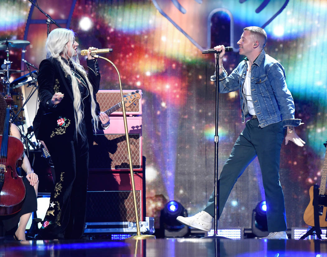 Kesha (L) and Macklemore perform onstage during the 2017 iHeartRadio Music Festival at T-Mobile Arena on September 23, 2017 in Las Vegas, Nevada.  (Photo by David Becker/Getty Images for iHeartMedia)