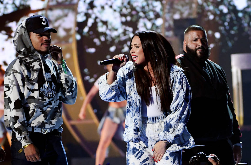 Chance the Rapper, Demi Lovato and DJ Khaled perform onstage during the 2017 iHeartRadio Music Festival at T-Mobile Arena on September 23, 2017 in Las Vegas, Nevada.  (Photo by Kevin Winter/Getty  ...