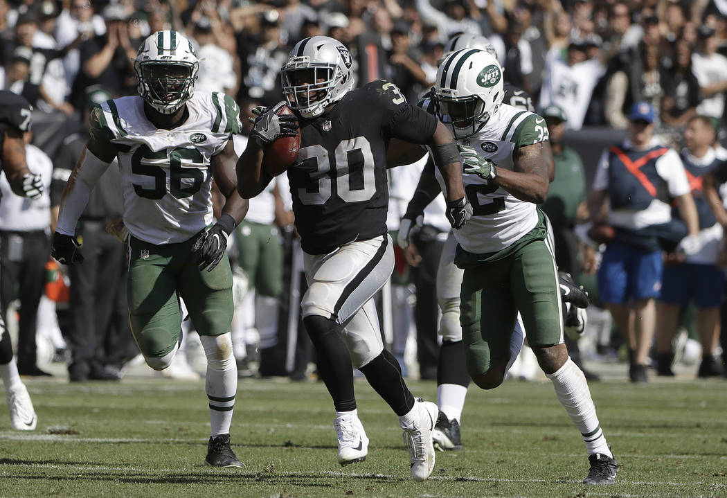 Oakland Raiders running back Jalen Richard (30) runs for a touchdown against the New York Jets during the second half of an NFL football game in Oakland, Calif., Sunday, Sept. 17, 2017. (AP Photo/ ...