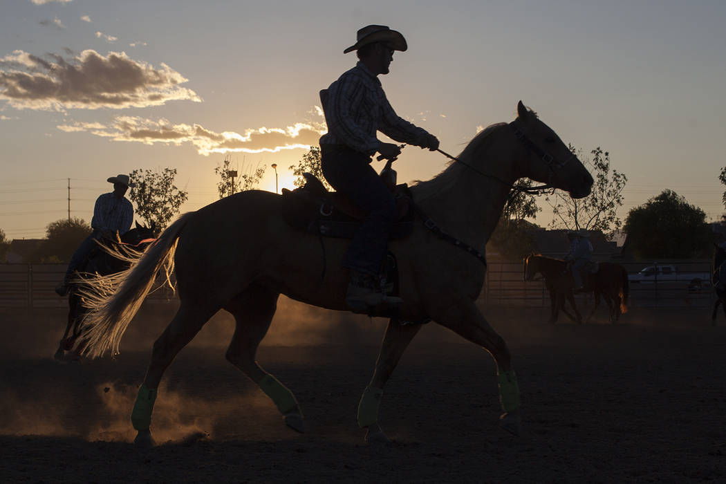 Riders take their horses for laps while waiting for the arena to be ready at the Bighorn Rodeo at Horseman's Park in Las Vegas, Saturday, Sept. 23, 2017. The rodeo is put on by the Nevada Gay Rode ...