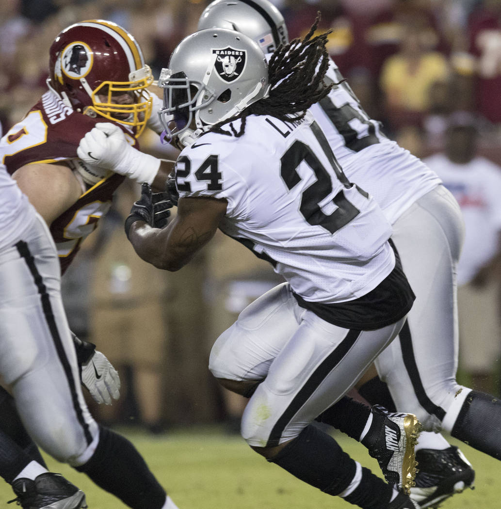 Oakland Raiders running back Marshawn Lynch (24) carries the football in the first half of the game against the Washington Redskins in Landover, Maryland, Sunday, Sept. 24, 2017. Heidi Fang Las Ve ...