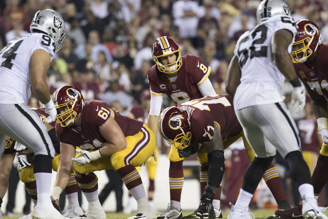 Washington Redskins quarterback Kirk Cousins (8) calls a play in the first half of their game against the Oakland Raiders in Landover, Md., Sunday, Sept. 24, 2017. Heidi Fang Las Vegas Review-Jour ...