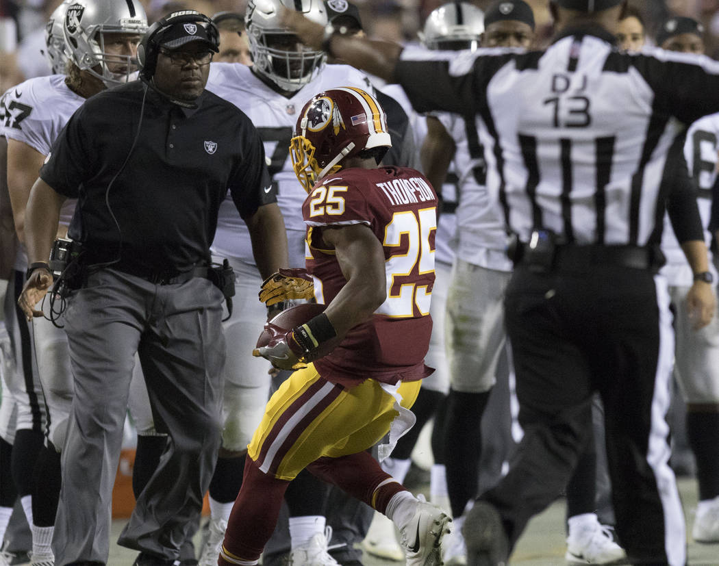 Washington Redskins running back Chris Thompson (25) runs out of bounds by the Oakland Raiders sideline in the first half of their game in Landover, Md., Sunday, Sept. 24, 2017. Heidi Fang Las Veg ...