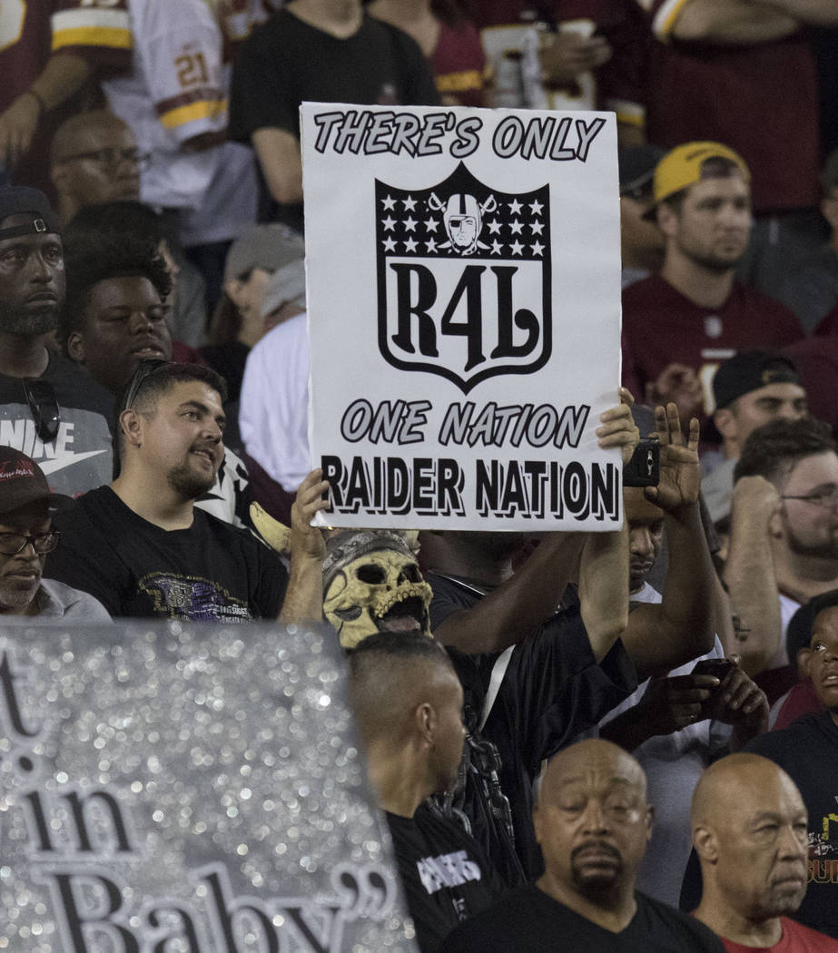 An Oakland Raiders fan holds up a sign in the first half of the team's game against the Washington Redskins at FedEx Field in Landover, Maryland, Sunday, Sept. 24, 2017. Heidi Fang Las Vegas Revie ...