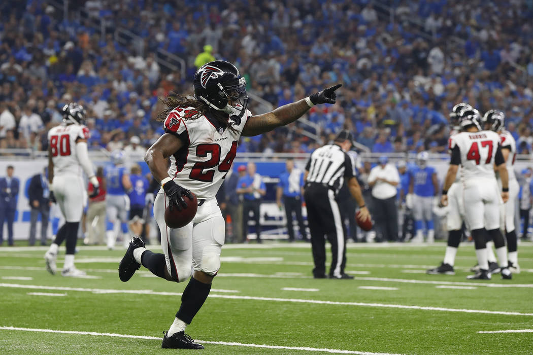 Atlanta Falcons running back Devonta Freeman gestures after scoring a touchdown during the first half of an NFL football game against the Detroit Lions, Sunday, Sept. 24, 2017, in Detroit. (AP Pho ...