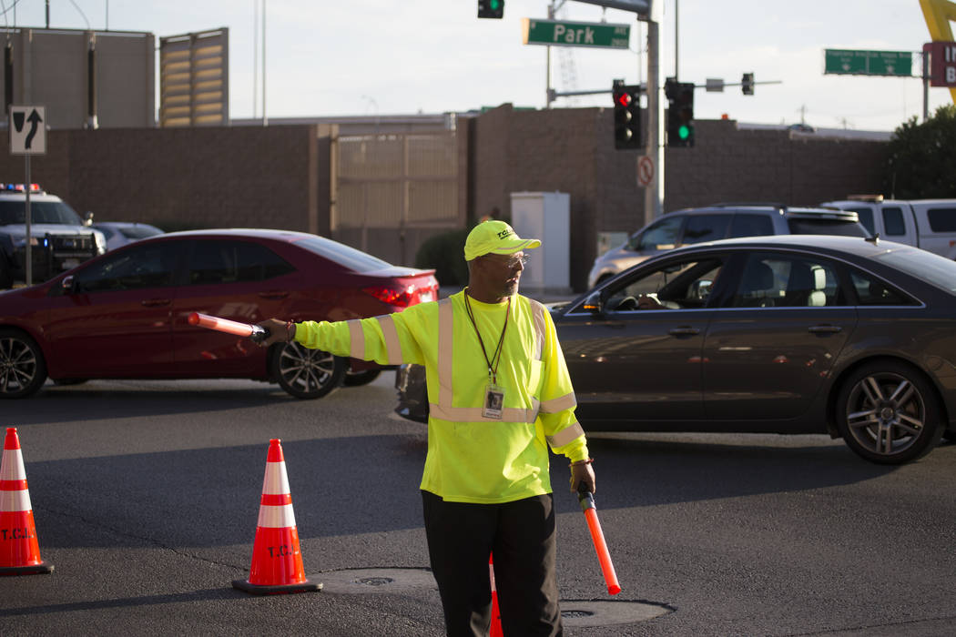 A traffic guard directs vehicles before the first preseason home game for the Vegas Golden Knights at T-Mobile Arena in Las Vegas, Tuesday, Sept. 26, 2017. Erik Verduzco Las Vegas Review-Journal @ ...