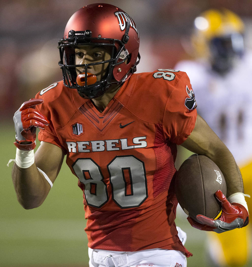 UNLV Rebels wide receiver Brandon Presley (80) heads towards the end zone for a touchdown after making a reception during the first half of an NCAA college football game between the UNLV Rebels an ...