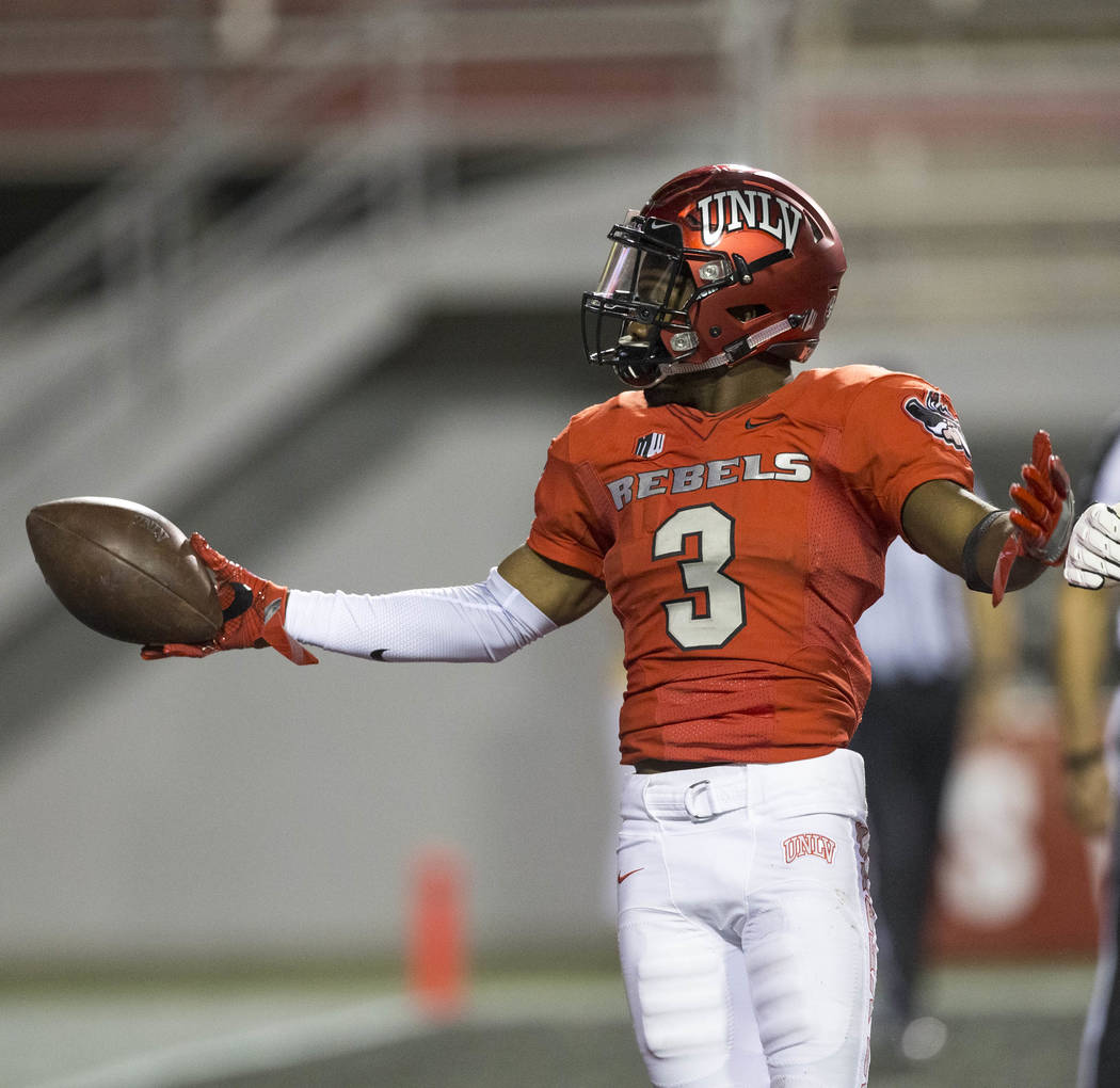 UNLV Rebels running back Lexington Thomas (3) celebrates in the end zone after scoring a touchdown during the first half of an NCAA college football game between the UNLV Rebels and the San Jose S ...