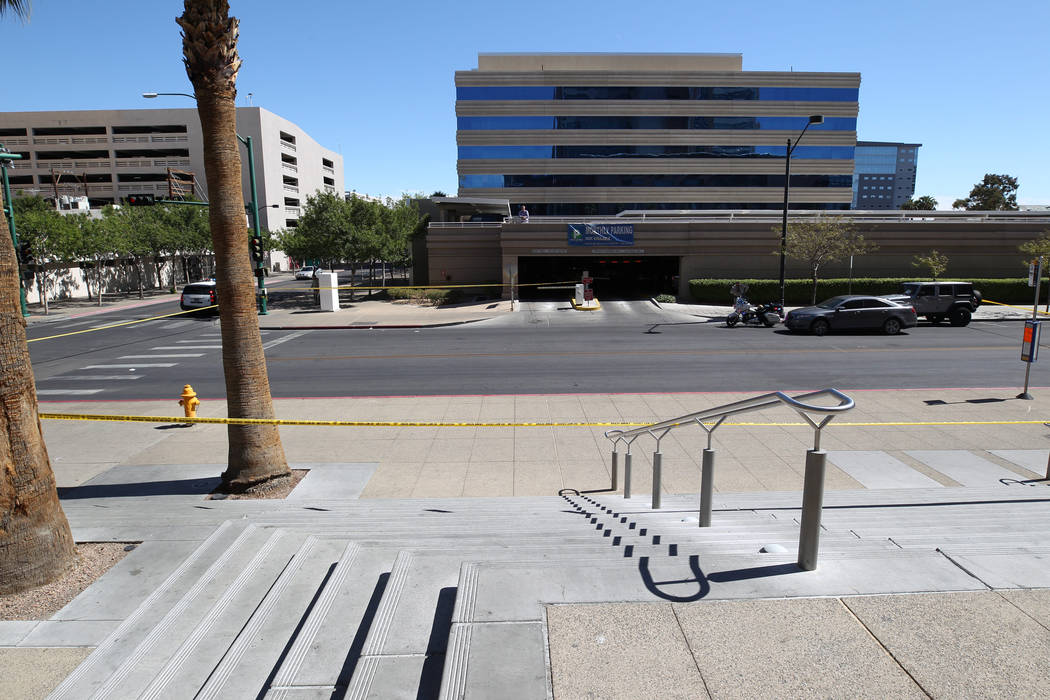 Las Vegas investigate at the Regional Justice Center at Third Street and Lewis Avenue in downtown Las Vegas where a witness in a murder trial was struck and injured by a vehicle Monday, Sept. 25, ...