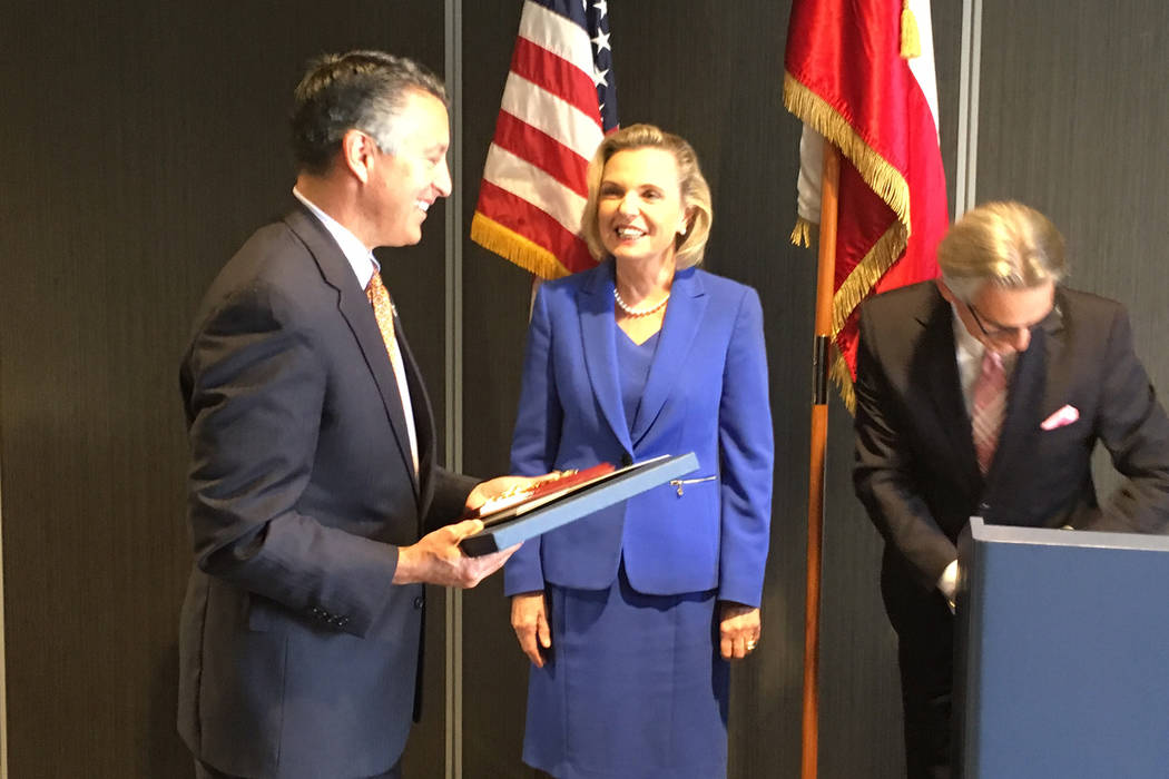 Gov. Brian Sandoval accepts the Friend of Poland award from Polish Senator Anna Maria Anders at a luncheon Tuesday, Sept. 26, 2017, in Reno. Sean Whaley Las Vegas Review-Journal