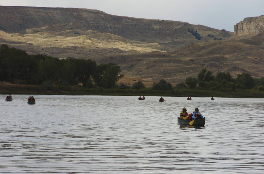 A group canoes through the Upper Missouri River Breaks National Monument on Sept. 19, 2011, near Fort Benton, Montana. Interior Secretary Ryan Zinke says he will not recommend changes to Montana's ...