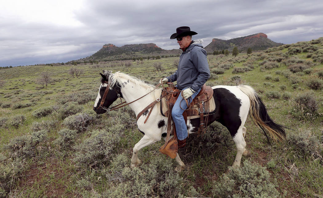 Interior Secretary Ryan Zinke rides a horse May 9, 2017, in the new Bears Ears National Monument near Blanding, Utah. Zinke has closely followed his boss' playbook, encouraging mining and drilling ...
