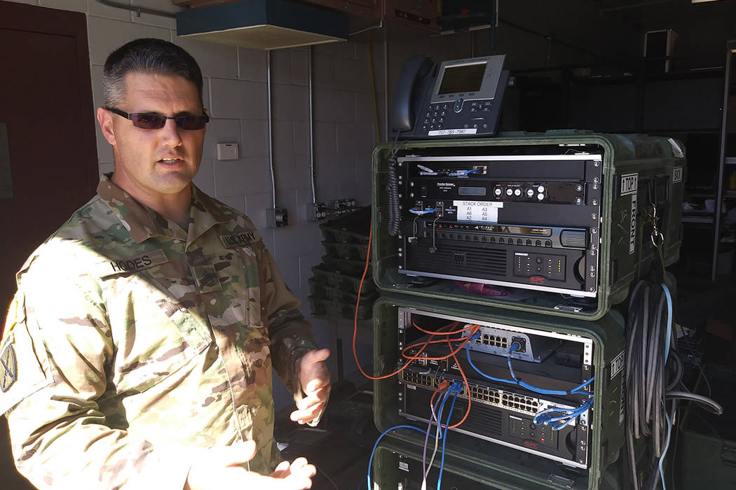 Sgt. 1st Class Ken Hodes of the Nevada Army National Guard talks Wednesday about communications equipment he will use on during a deployment to Puerto Rico. Six Nevada Army National Guard members ...