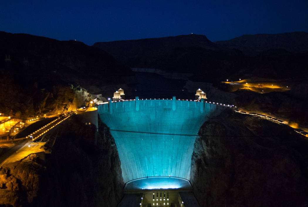 Hoover Dam, lit up turquoise to promote lung cancer awareness, as seen from O'Callaghan-Tillman Memorial Bridge on Thursday, May 11, 2017. Chase Stevens Las Vegas Review-Journal @csstevensphoto
