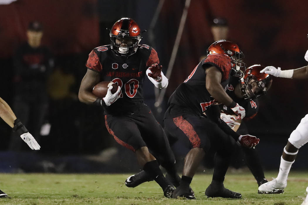 San Diego State running back Rashaad Penny runs with the ball during the first half of an NCAA college football game against Northern Illinois, Saturday, Sept. 30, 2017, in San Diego. (AP Photo/Gr ...