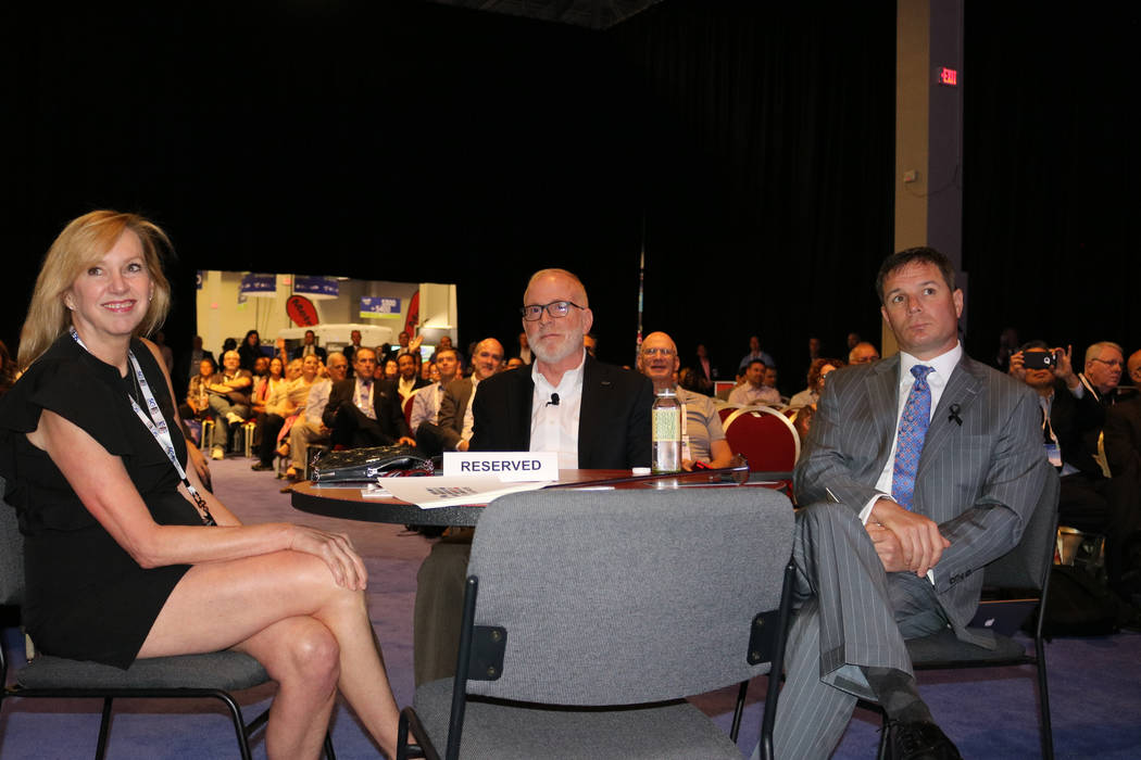 Susan Cartwright, vice president of corporate communications for Scientific Games (left), Scientific Games CEO Kevin Sheehan and Geoff Freeman, president and CEO of the American Gaming Association ...