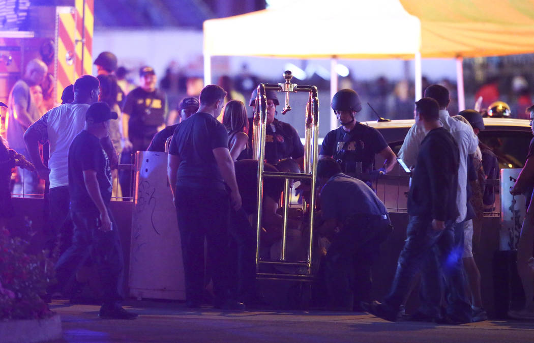 A wounded woman is moved outside of the Tropicana during an active shooter situation on the Las Vegas Stirp in Las Vegas on Sunday, Oct. 1, 2017. Chase Stevens Las Vegas Review-Journal @csstevensphoto