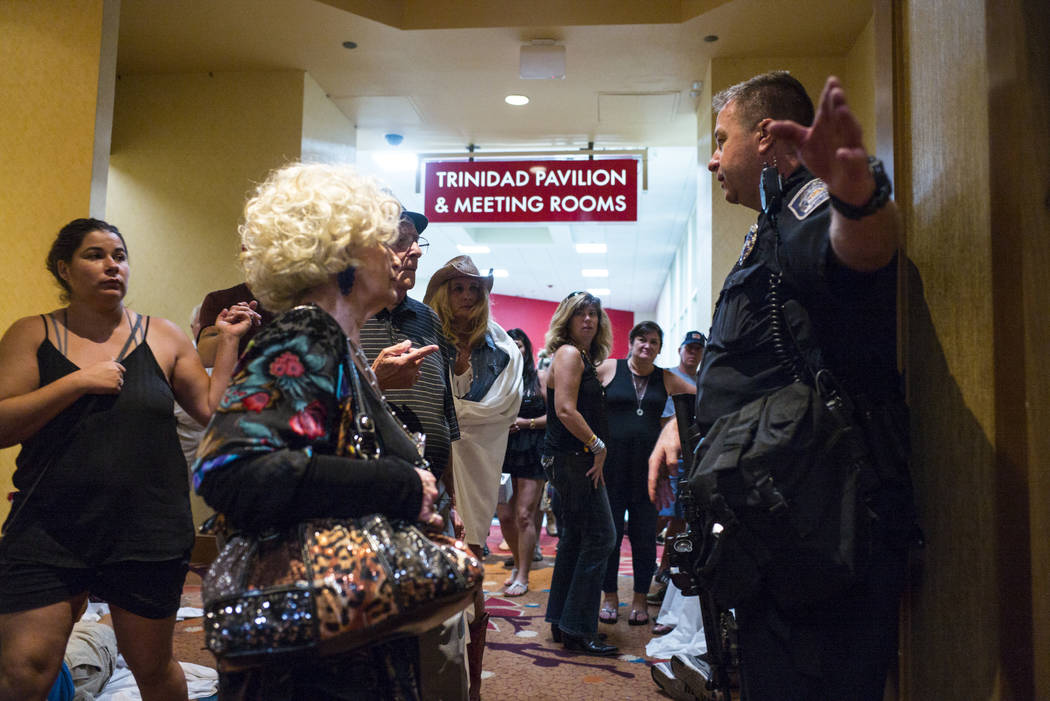 A police officer directs people at the Tropicana Las Vegas following an active shooter situation that left 50 dead and over 200 injured on the Las Vegas Strip during the early hours of Monday, Oct ...