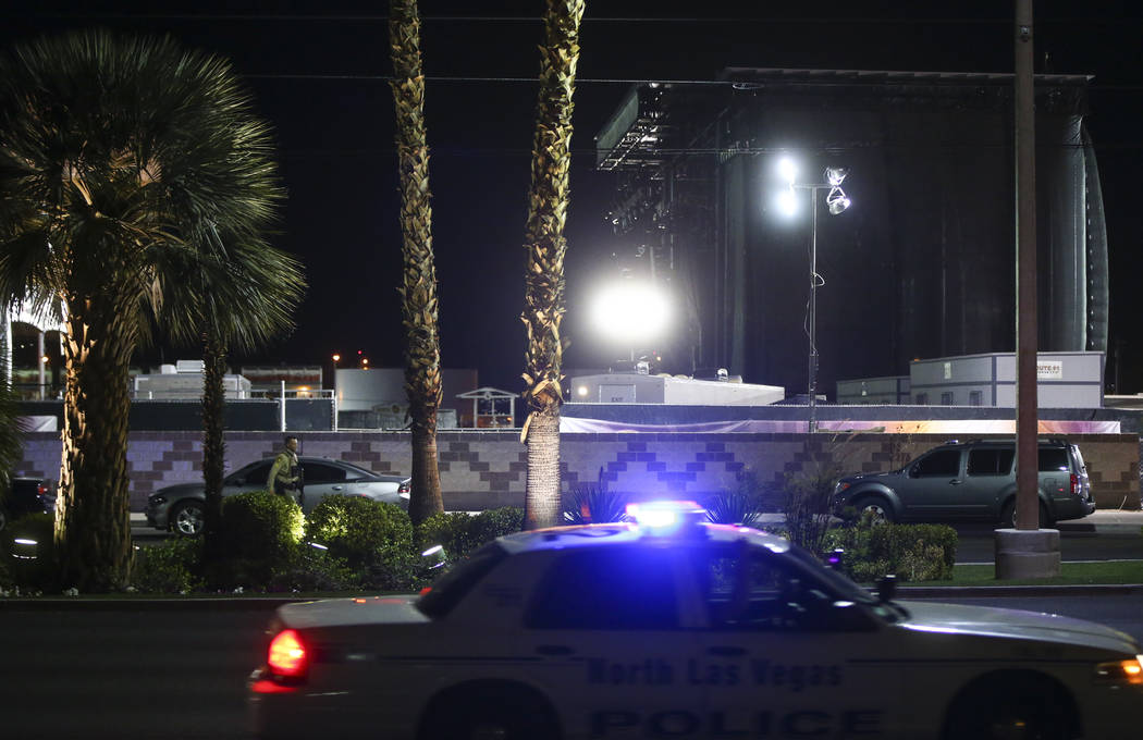 Festival grounds for Route 91 rise in the background as Las Vegas police investigate following an active shooter situation that left 50 dead and over 200 injured on the Las Vegas Strip during the  ...