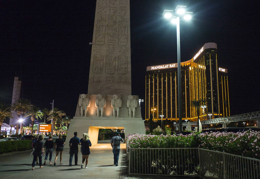 Tourists make their way back to their hotels following an active shooter situation that left 50 dead and over 200 injured on the Las Vegas Strip during the early hours of Monday, Oct. 2, 2017. Cha ...