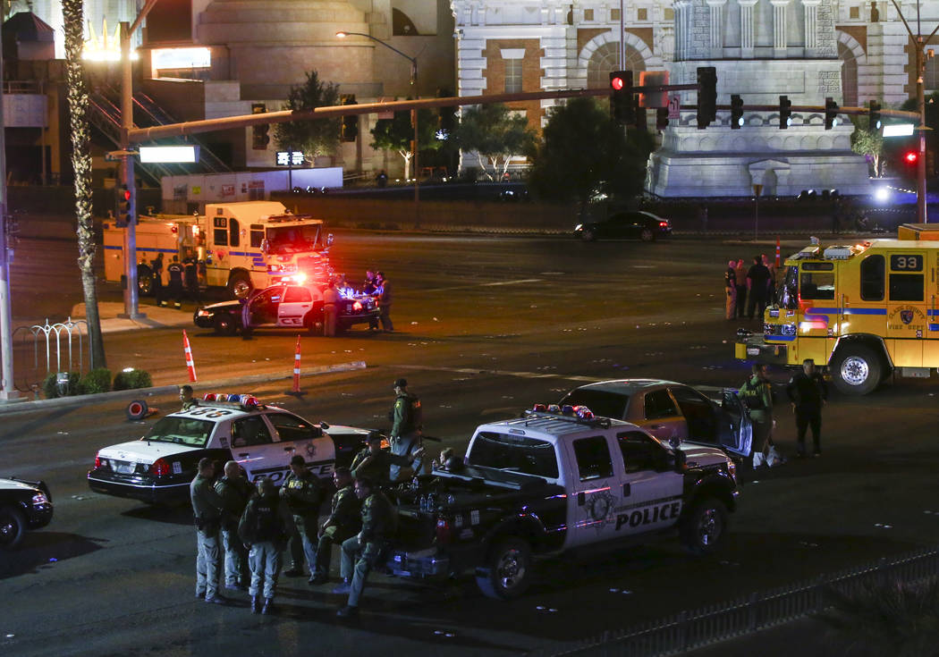 Las Vegas police gather following an active shooter situation that left 50 dead and over 200 injured on the Las Vegas Strip during the early hours of Monday, Oct. 2, 2017. Chase Stevens Las Vegas  ...