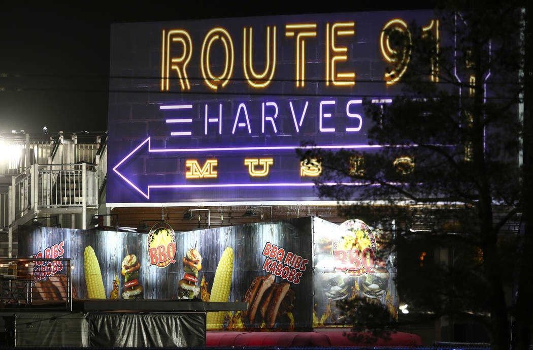 Festival grounds for Route 91 rise in the background as Las Vegas police investigate following an active shooter situation that left 50 dead and over 200 injured on the Las Vegas Strip during the  ...