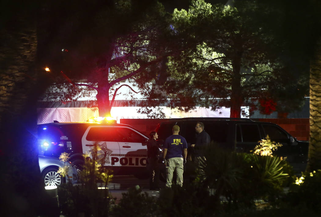 Las Vegas police investigate following an active shooter situation that left 50 dead and over 200 injured on the Las Vegas Strip during the early hours of Monday, Oct. 2, 2017. Chase Stevens Las V ...