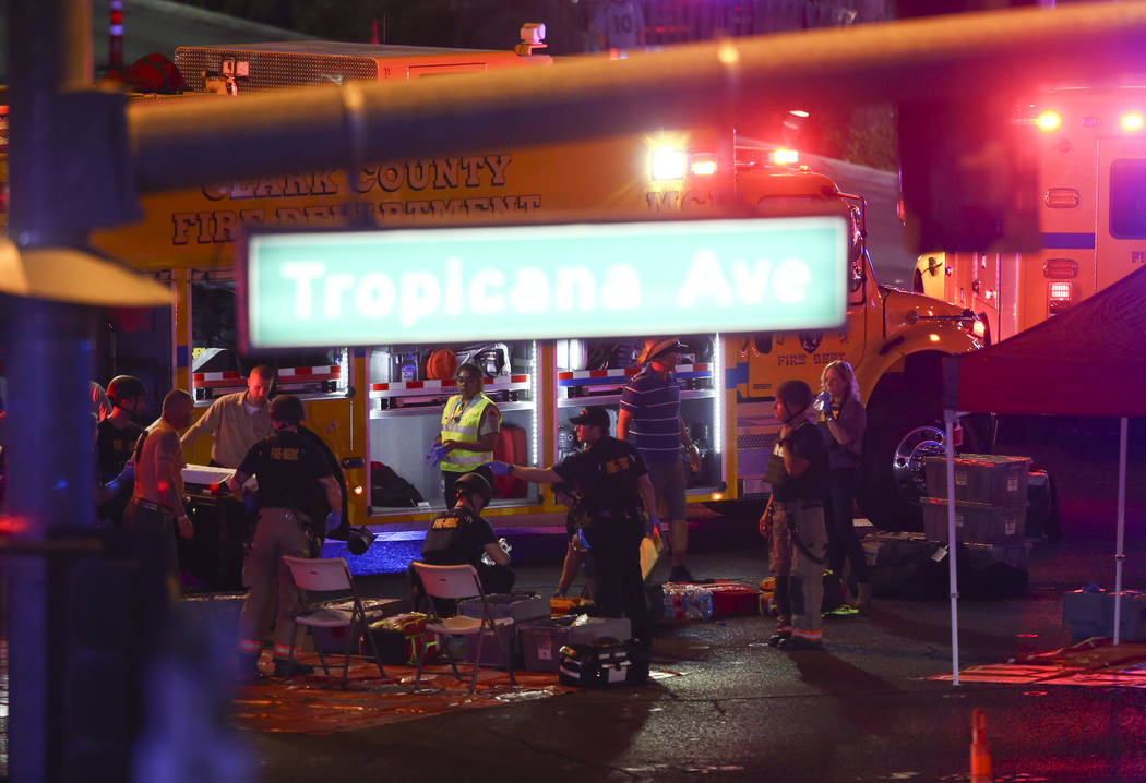 Medics treat the wounded as Las Vegas police respond during an active shooter situation on the Las Vegas Strip on Sunday, Oct. 1, 2017. Chase Stevens Las Vegas Review-Journal @csstevensphoto