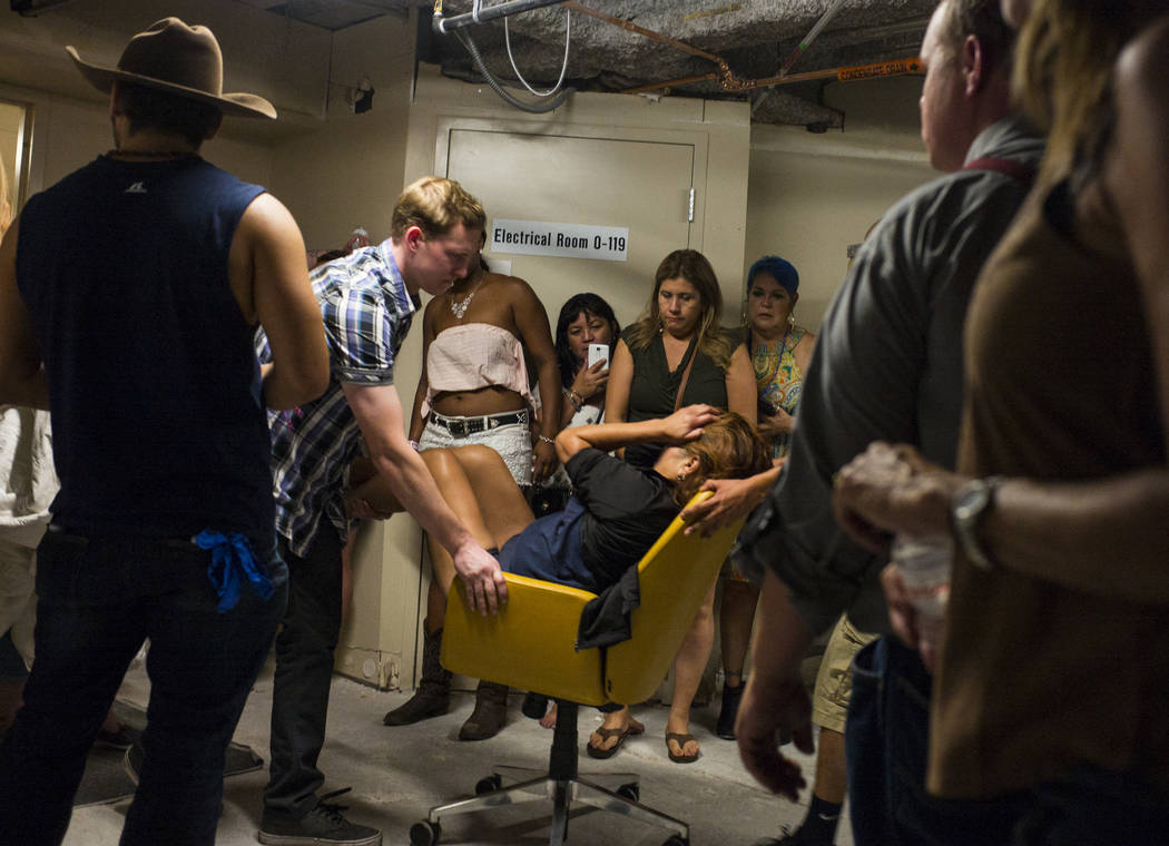 People assist a wounded woman at the Tropicana Las Vegas during an active shooter situation on the Las Vegas Strip on Sunday, Oct. 1, 2017. Chase Stevens Las Vegas Review-Journal @csstevensphoto