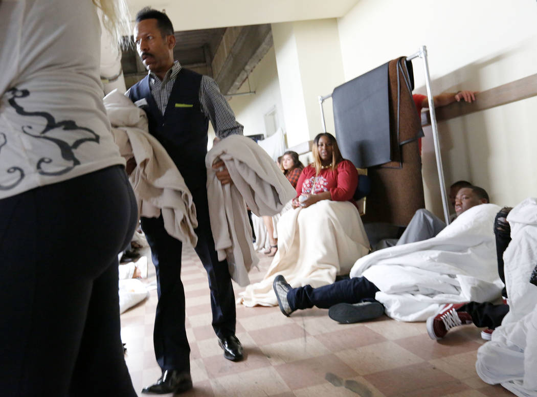 A Luxor staff member brings blankets to the evacuees at the baseman of the Luxor during a shooting, Monday, Oct. 2, 2017, in Las Vegas. Chitose Suzuki Las Vegas Review-Journal