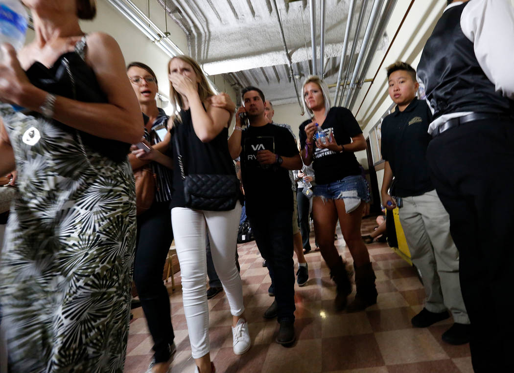 People evacuate to the Luxor during a shooting, Sunday, Oct. 1, 2017, in Las Vegas. Chitose Suzuki Las Vegas Review-Journal