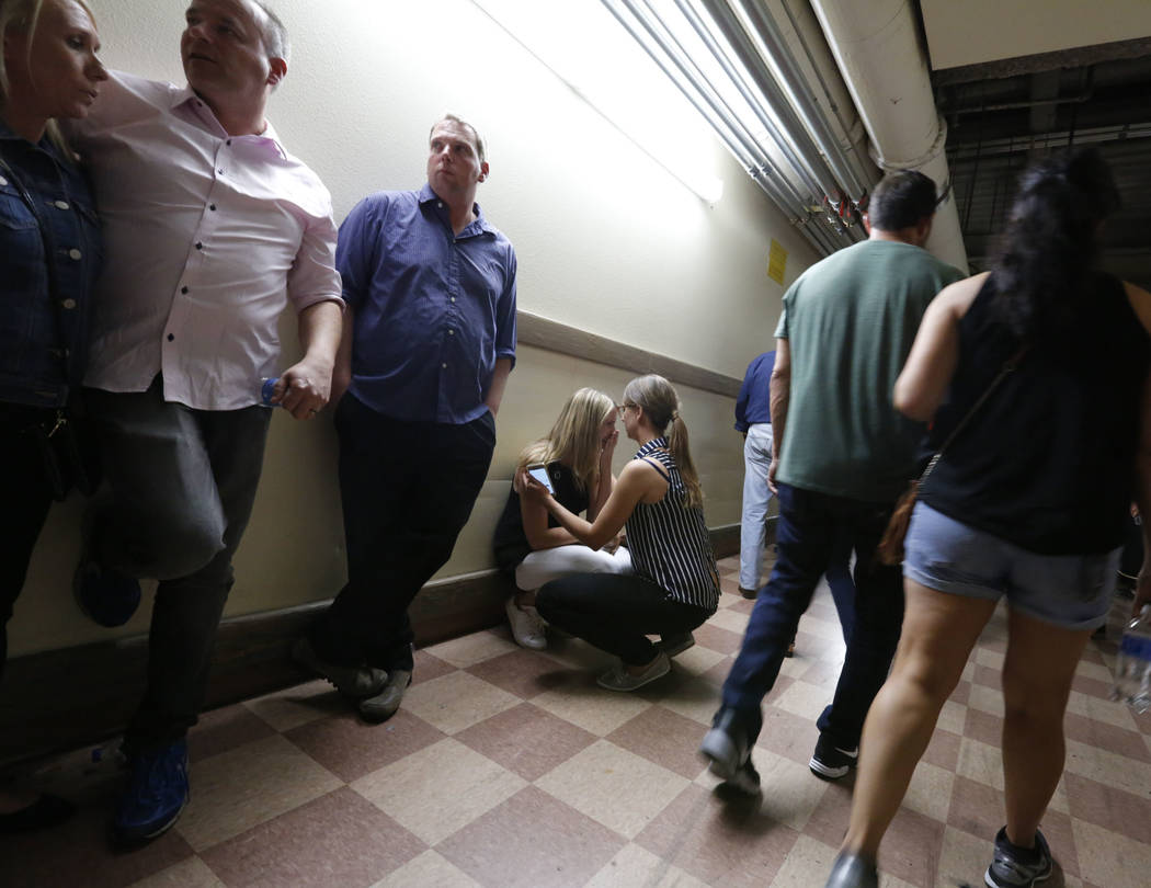 People evacuate to the Luxor during a shooting, Sunday, Oct. 1, 2017, in Las Vegas. Chitose Suzuki Las Vegas Review-Journal