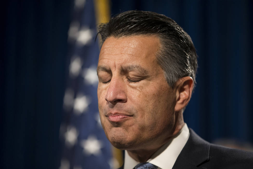 Gov. Brian Sandoval pauses as he discusses the mass shooting during a press conference at the Las Vegas Metropolitan Police Department headquarters in Las Vegas, Monday, Oct. 2, 2017. Erik Verduzc ...