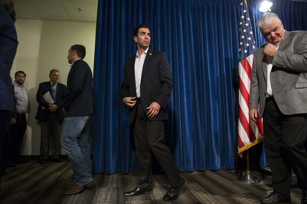 U.S. Rep. Ruben Kihuen, D-Nev., left, and Clark County Commissioner Steve Sisolak following a press conference on the mass shooting, at the Las Vegas Metropolitan Police Department headquarters in ...