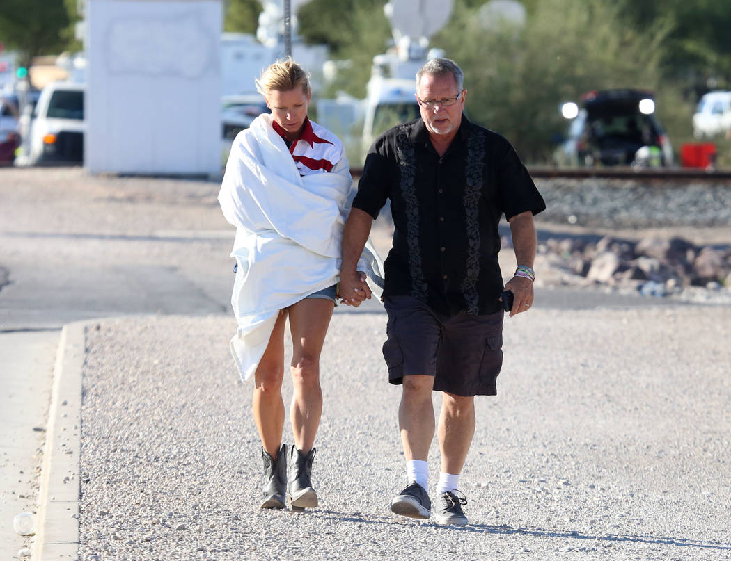 Kathy Boggio-Mocnik and her husband Gary, both of Aliso Viejo, Calif., return to Mandalay Bay hotel-casino on Monday, Oct. 2, 2017 where at least 58 people were killed and more than 400 others wer ...