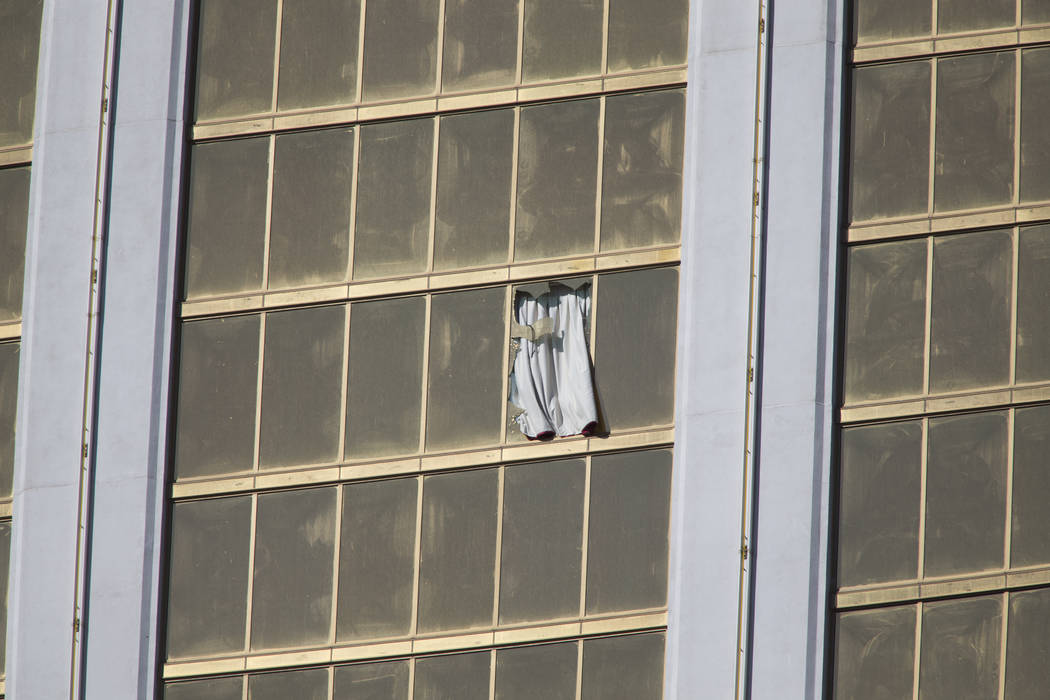 A broken Mandalay Bay window Monday, Oct. 2, 2017, after a Strip shooting left 58 dead and over 518 injured in Las Vegas Sunday night. Richard Brian Las Vegas Review-Journal @VegasPhotograph