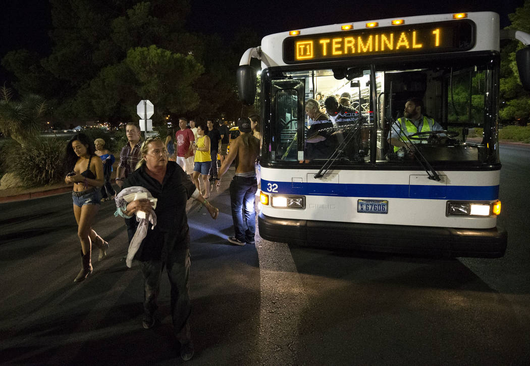 Festival-goers attending the Route 91 Harvest Festival were evacuated by bus to Thomas and Mack Arena early Monday morning, Oct. 2, 2017, following a shooting situation on the Las Vegas Strip. Ric ...